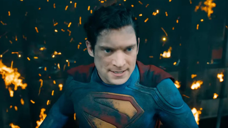 Superman surrounded by embers in Superman (2025)