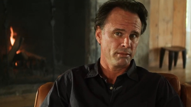 Waltong Goggins sitting near fireplace