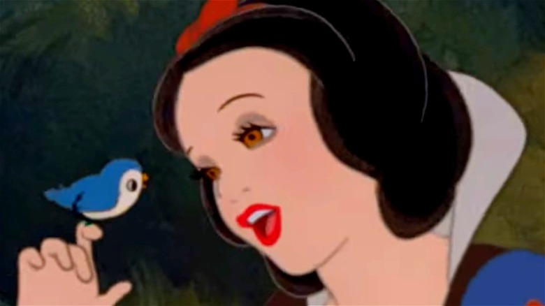 Snow white sings to a bird