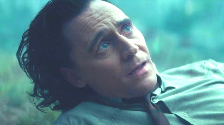 Tom Hiddleston as Loki looking up