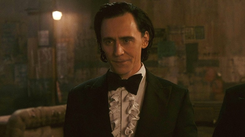 Loki wearing a green tuxedo