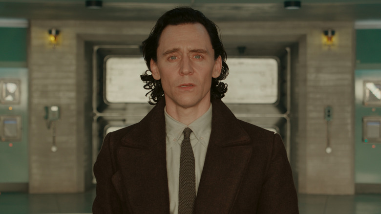 Loki wearing suit looking shocked