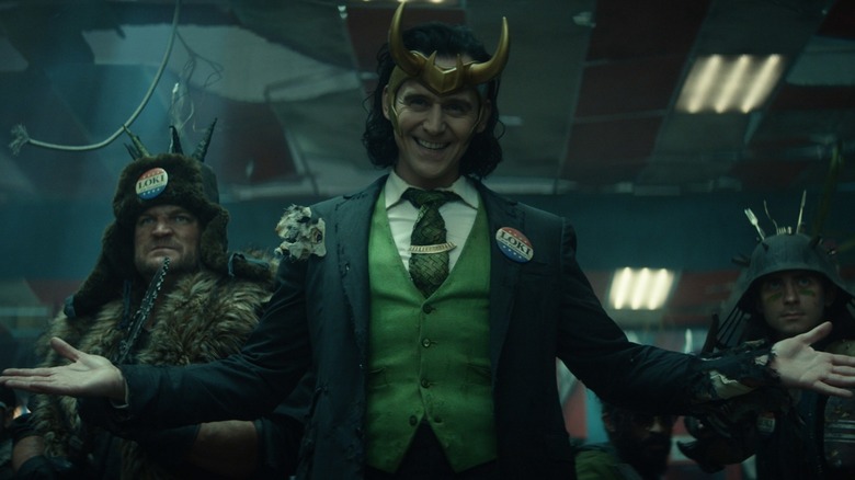 President Loki smiling arms outstretched