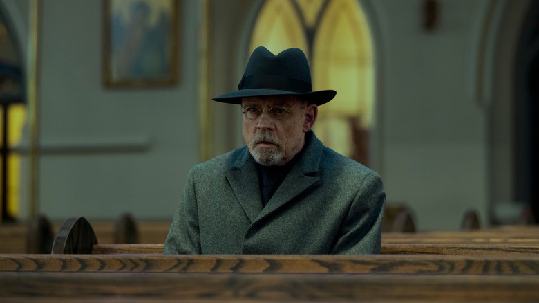 Albert Pym sitting in church