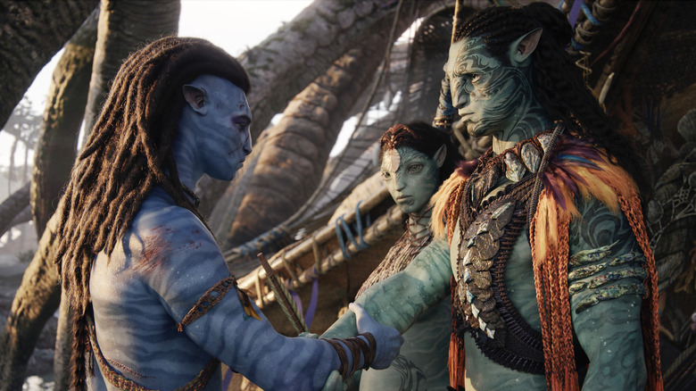 Sam Worthington, Kate Winslet, and Cliff Curtis as Na'vi in Avatar The Way of Water