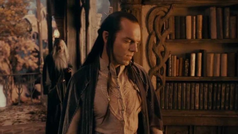 Elrond in library looks down