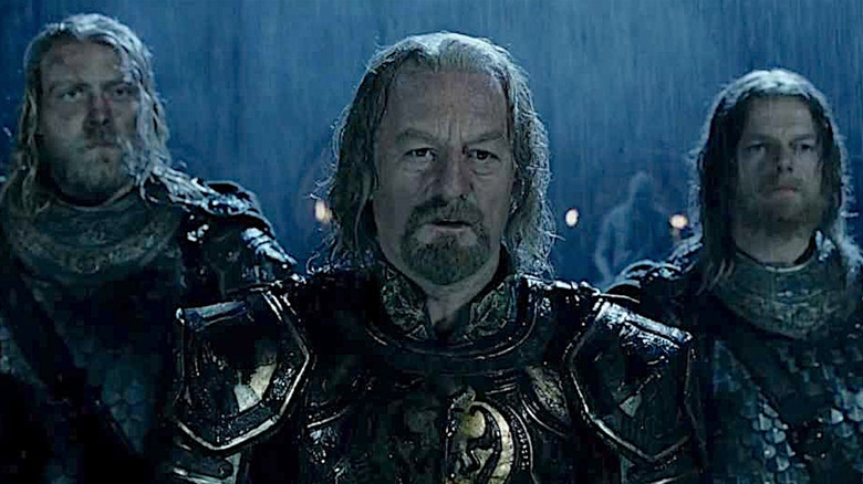 Théoden and two men in rain