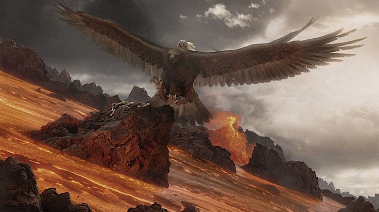 Eagle flies over lava