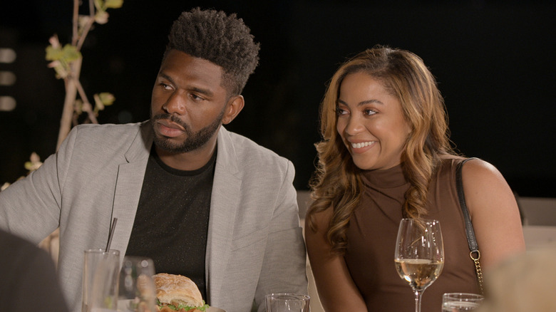 Brett Brown and Tiffany Pennywell sitting together at dinner