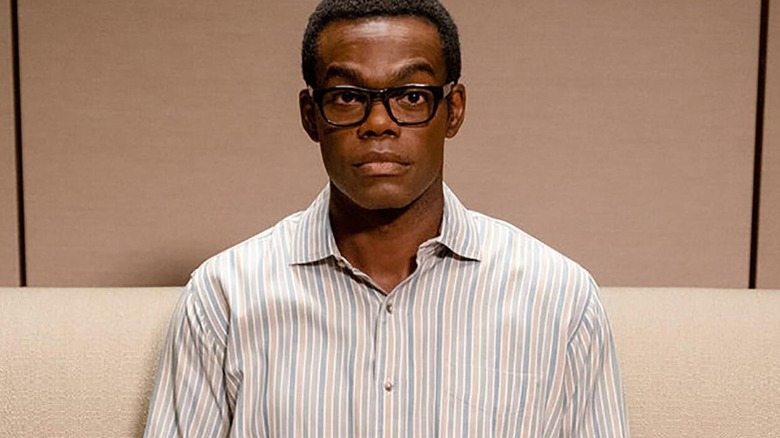 William Jackson Harper sitting on a couch
