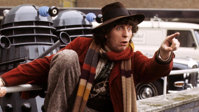 The 4th Doctor pointing before a host of Daleks in 