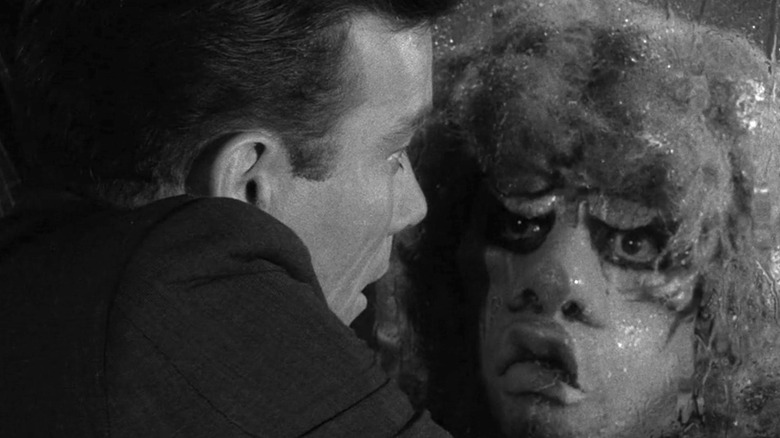 Robert Wilson frightened in the face of the gremlin in "The Twilight Zone"