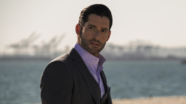 Lucifer standing on a beach