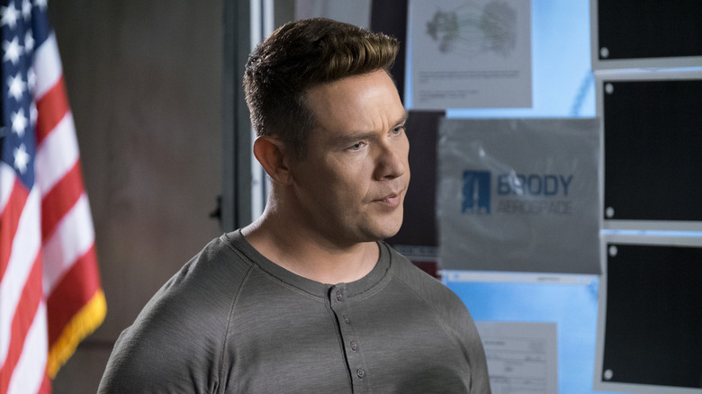 Kevin Alejandro as Dan looking annoyed