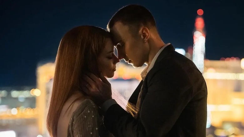 Lucky and Cary embracing on a rooftop in "Lucky" (2026)