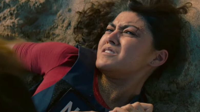 Lucy pinned against the sand