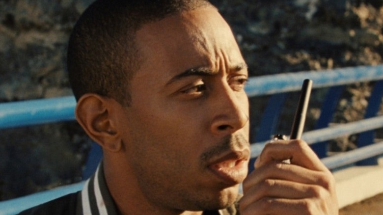 Ludacris speaks into walkie talkie in Fast and Furious
