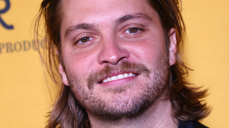 Luke Grimes smiles