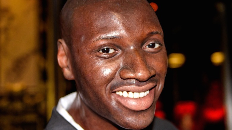 Omar Sy smiling up close