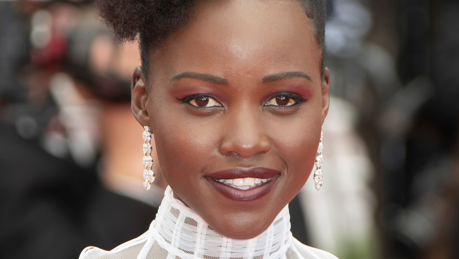 Behind-the-Scenes Look At Lupita Nyong'o's 2022 Oscars Hair and Makeup