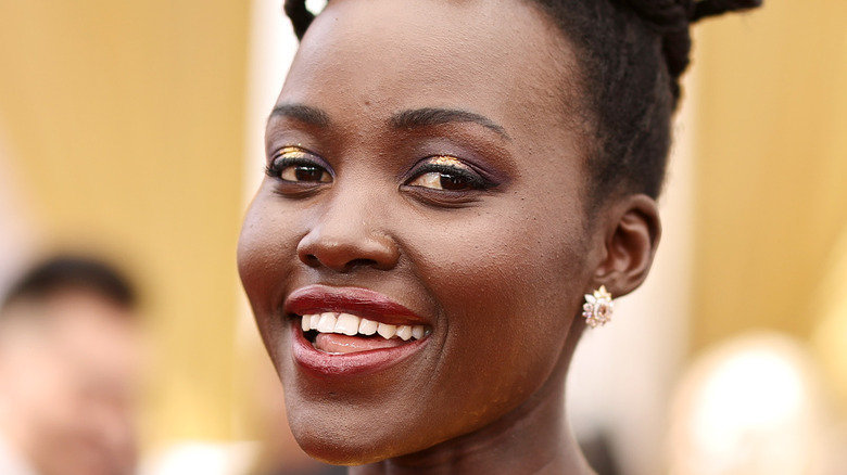 Lupita Nyong'o smiling at comic-con