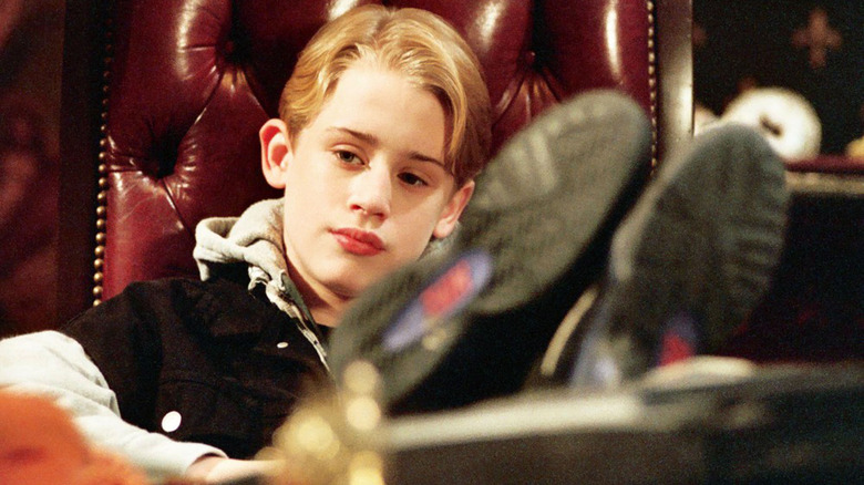 Macaulay Culkin sitting