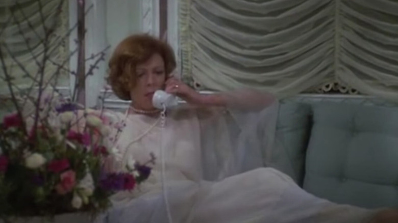 Maggie Smith lounging on the phone