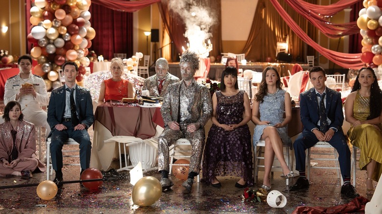 Kelly, Jamie, Reese, Lois, Hal, Francis, Piama, Leah, Malcolm, and Tristan sitting in the aftermath of a party (2026)