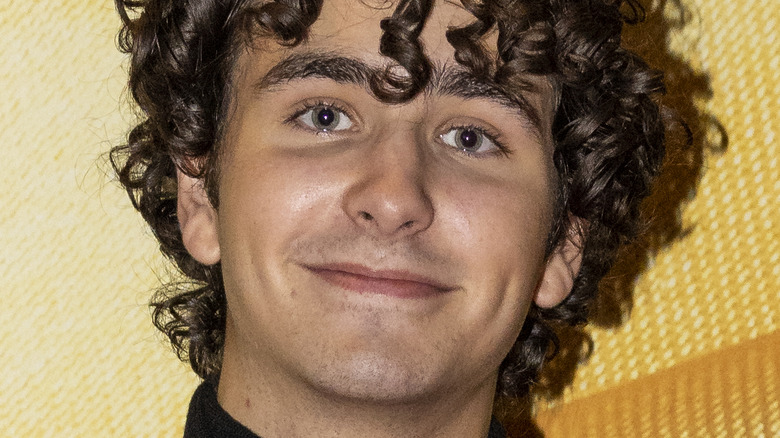 Malte Gårdinger smiling on yellow background