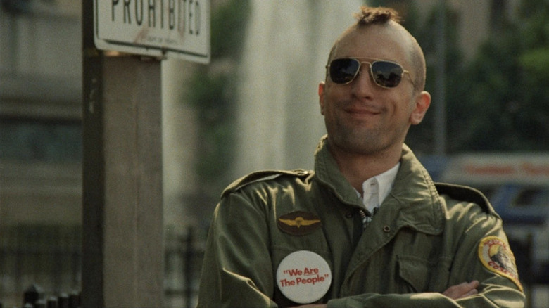 Travis Bickle smirking in sunglasses in Taxi Driver