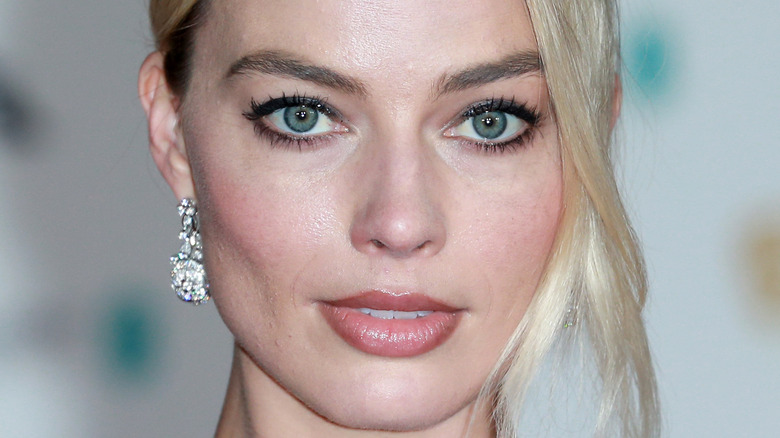 Margot Robbie looking into camera