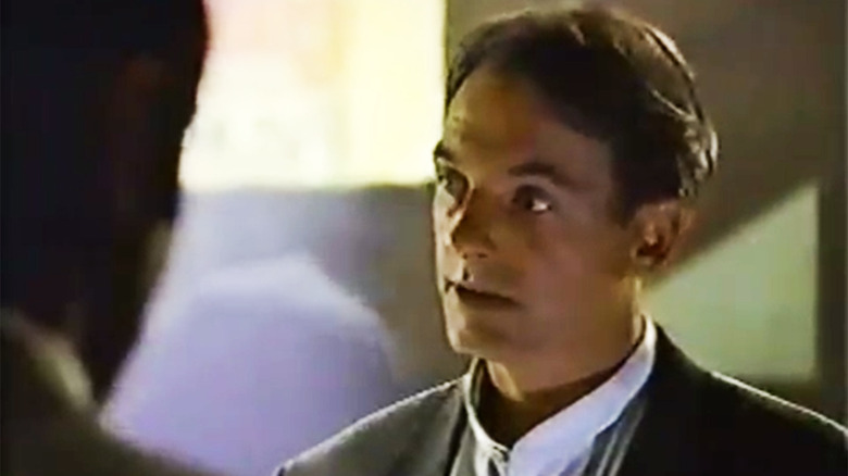 Charlie talking to someone just out of frame in Charlie Grace (1995)