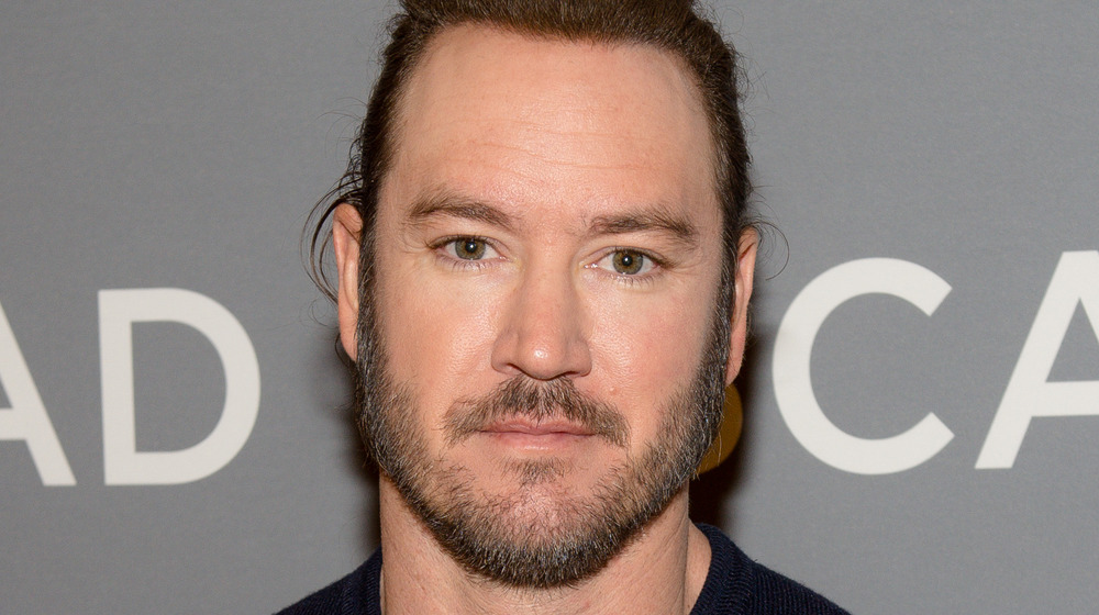 Mark-Paul Gosselaar with blue sweater and beard