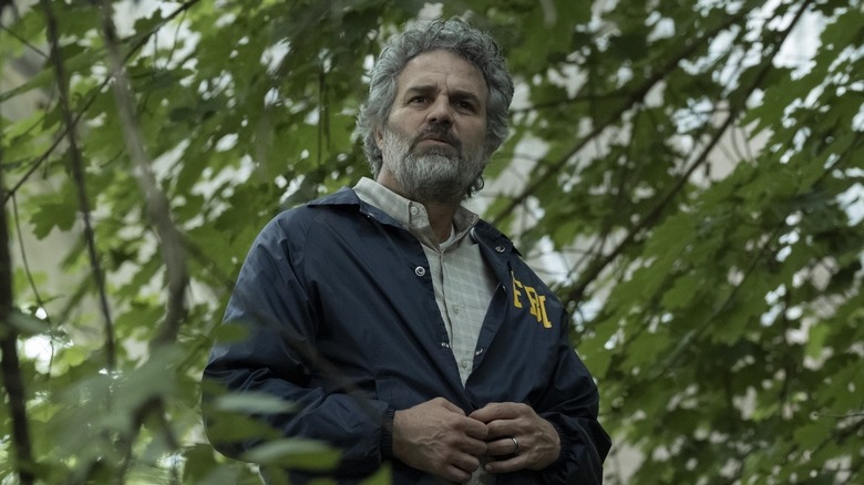 Tom Brandis standing outside in trees in Task (2025)