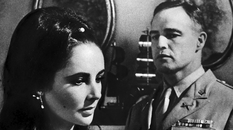 Marlon Brando stares at Elizabeth Taylor