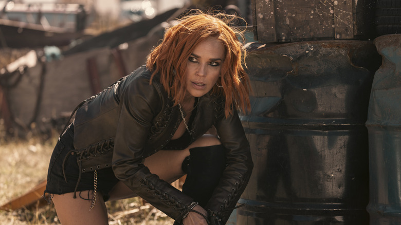 Belle crouches in costume in "Marshals"