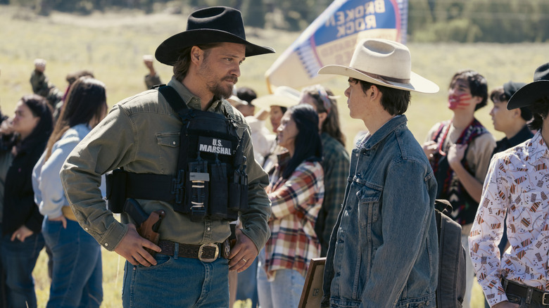 Kayce talking to Tate at a protest on Marshals