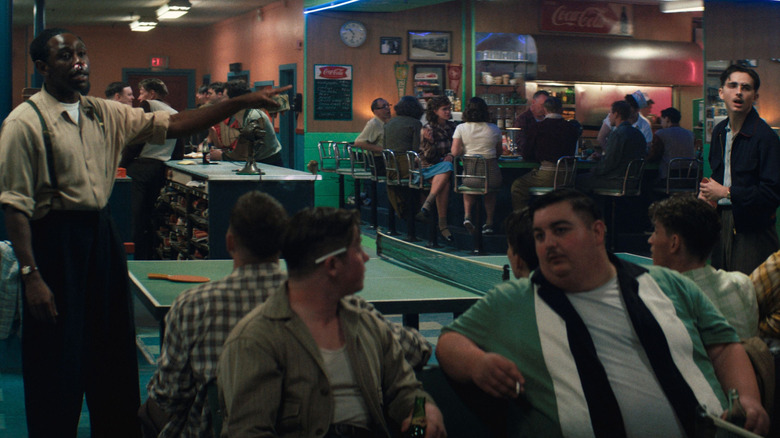 Wally and Marty standing in crowded bar