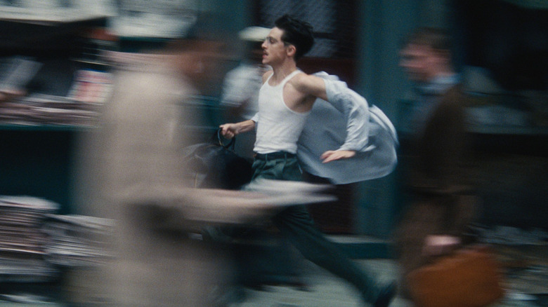 Marty Mauser running through the streets