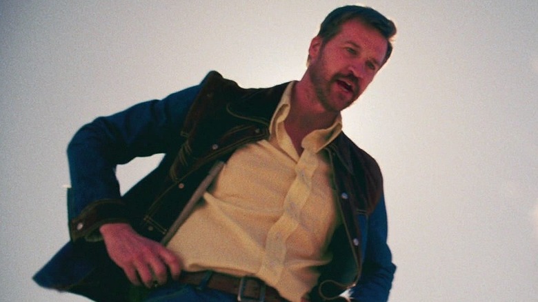 Joseph Danvers standing over Carol in Captain Marvel (2019)