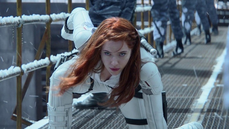 Black Widow crouching in armored white suit in "Black Widow" (2021)