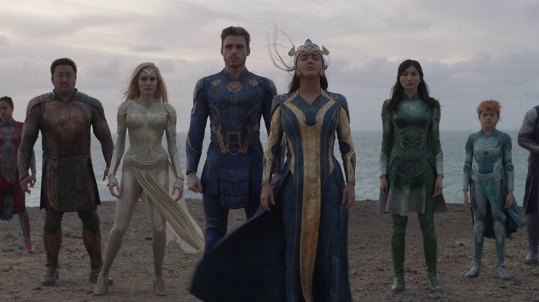The Eternals standing on a beach in "Eternals" (2021)