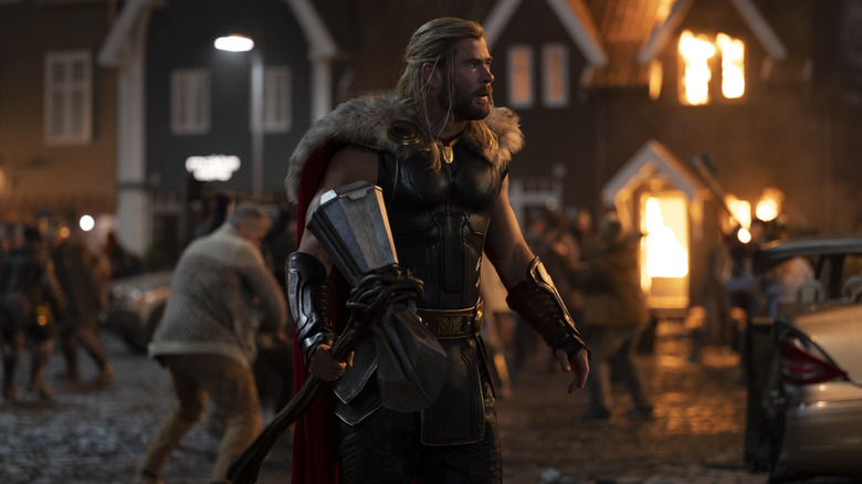 Thor fighting villains in New Asgard in "Thor: Love and Thunder" (2022)