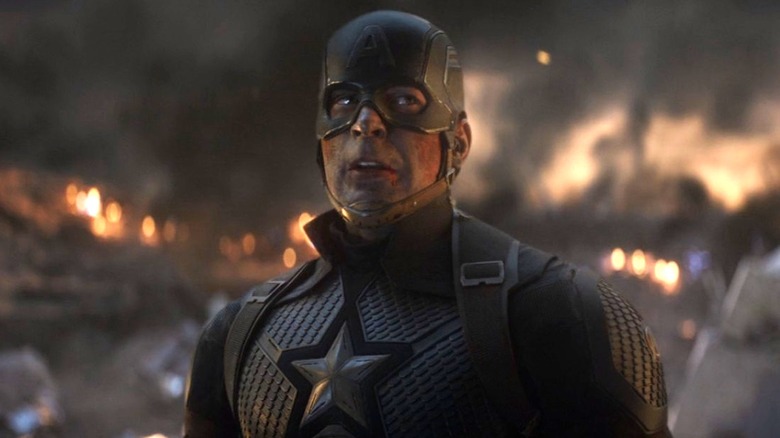 Captain America standing in battlefield