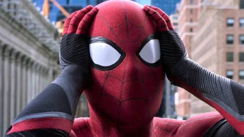 Spider-Man holding head shocked