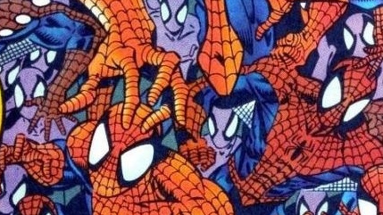 A group of Spider-Man clones climb all over one another