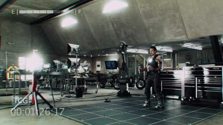 Tony Stark working on his suit in Iron Man