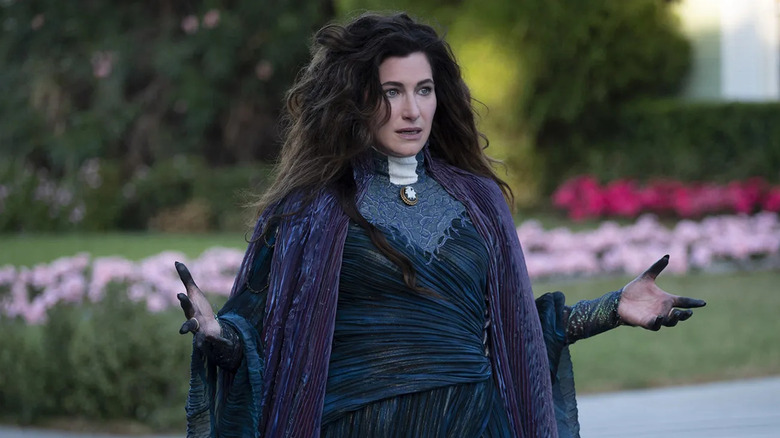 Agatha stands in witch garb, hands outstretched with blackened fingers in Agathat All Along.