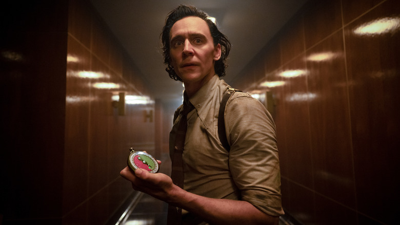 Loki in hallway holding device