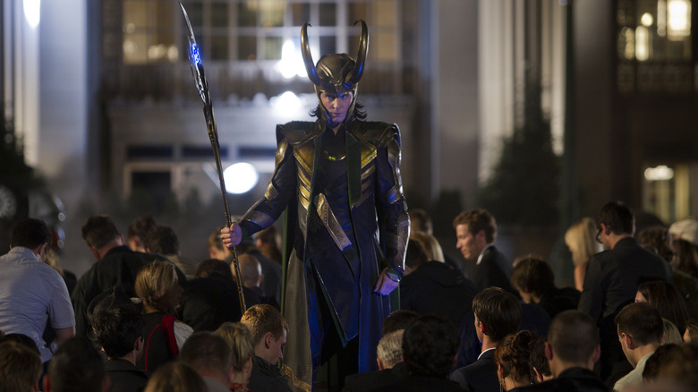 Loki with scepter in front of crowd